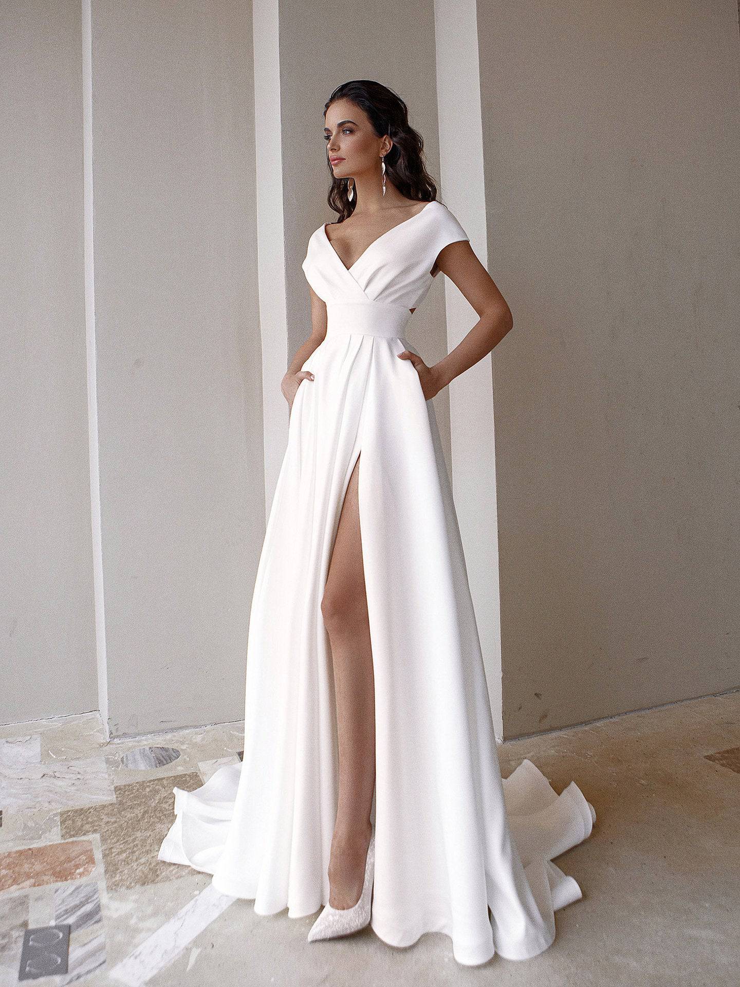 Elegant White Wrapped Maxi Dress with Ruffled Detail    