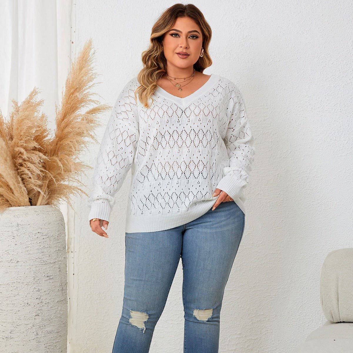 A white, plus-size knitted hollow out V neck sweater for curvy women